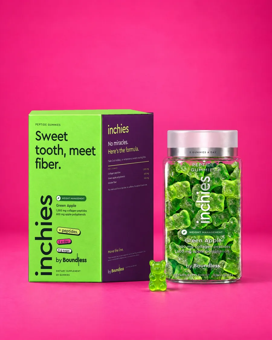 A green apple inchies peptide gummies box and jar on a pink background, with a gummy bear in front