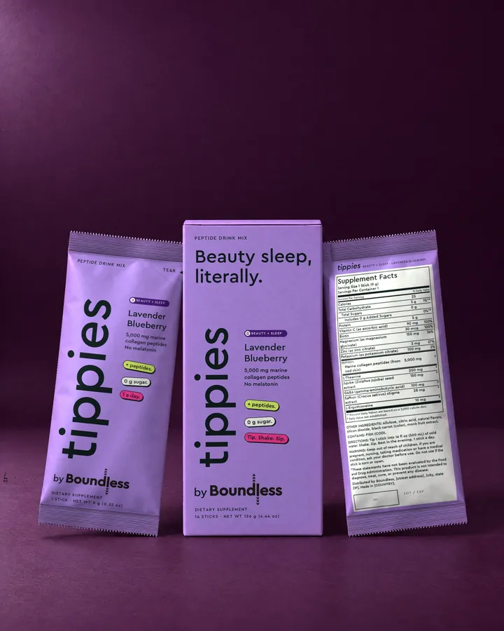 tippies Beauty + Sleep lavender blueberry peptide drink mix, box and sticks on a purple background
