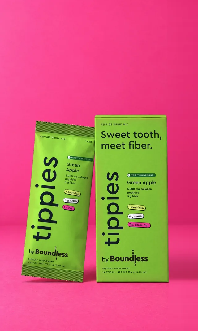 A green apple tippies Weight Management box and drink mix stick on a pink background